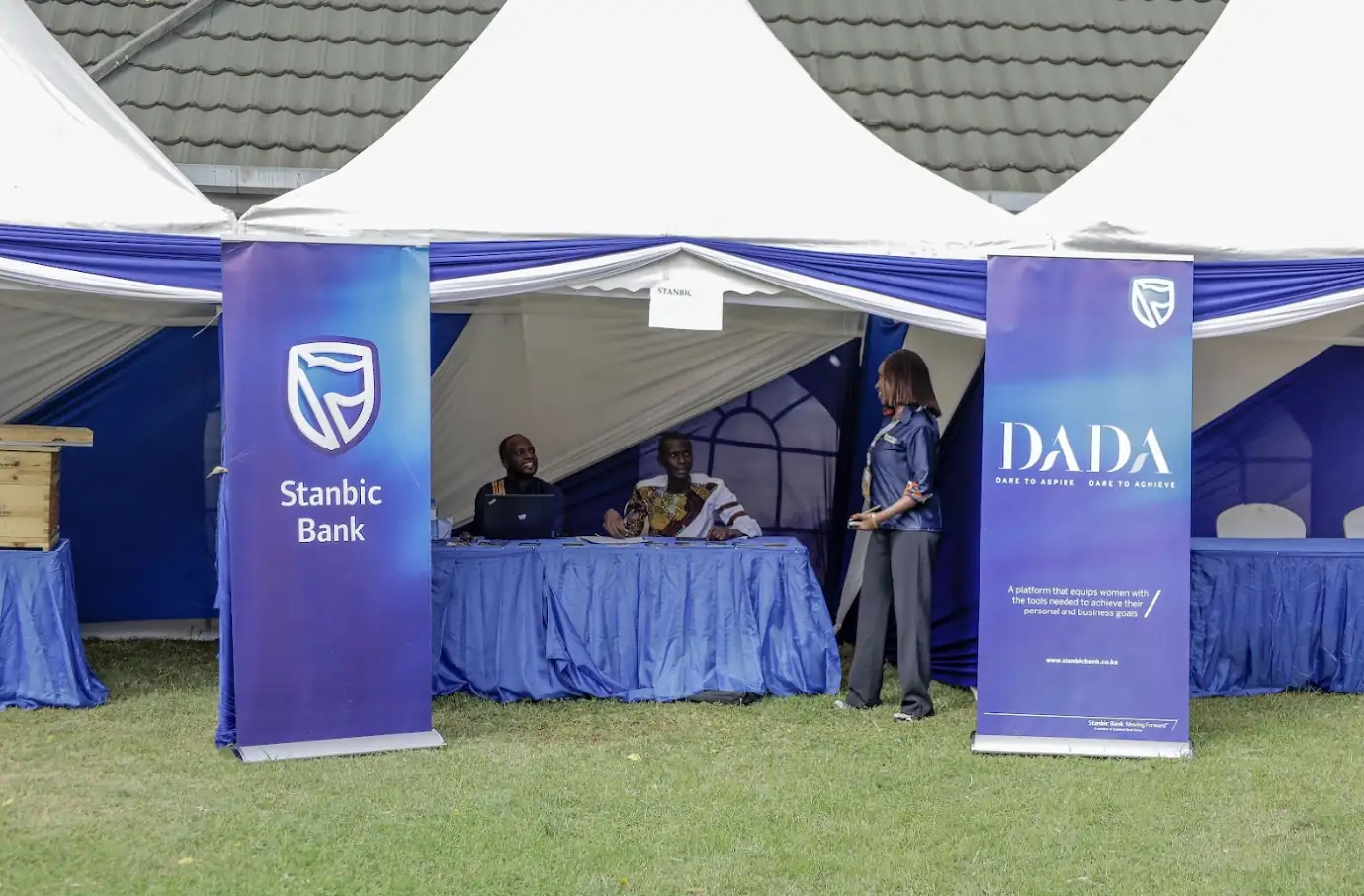 Teacher assisting a student at a computer